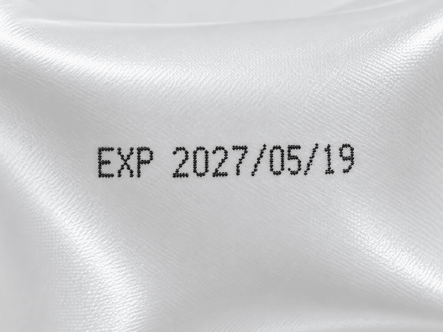 Close-up expiry date printed on flexible film